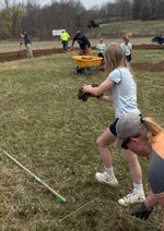 people working on a baseball field