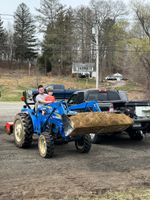 two people on a tractor