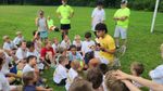 Children listening to a man