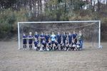 An elementary school soccer team in blue uniforms