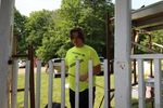a teenager working on fixing a railing