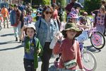 children and their parents walking in a parade