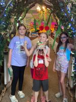 Children posing in a colorfully-decorated room