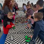 children building with legos at a table