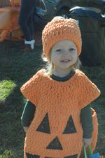 A child in a pumpkin costume