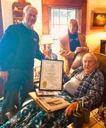 State Senator Jeff Gordon and First Selectman presenting a state citation to a Anthony Tiemann