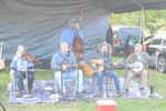 a band with a fiddle, a mandolin, a guitar, a banjo, and an upright bass