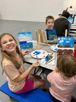 Children painting at a table