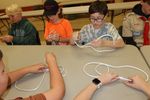 Scouts learning how to tie knots
