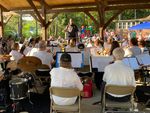 a band playing under a pavilion