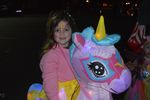 a child with a large toy unicorn
