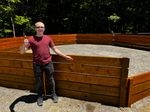 a teenager poses next to a gaga pit