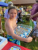 a boy holding a cake