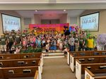 Children and adults posing for a picture
