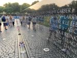 a group of students walking at the Vietnam Memorial